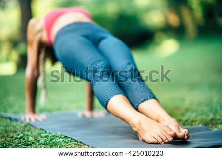 Girl doing Yoga, Reverse Plank Pose or Purvottanasana