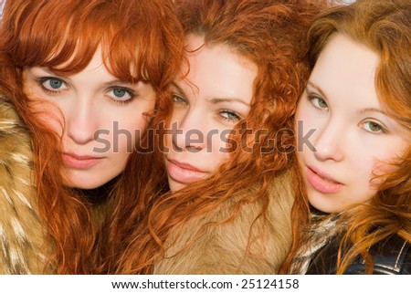 Three beautiful red hair girls closeup