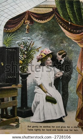 Old fashioned love, couple in photostudio- circa 1904 hand-tinted photograph