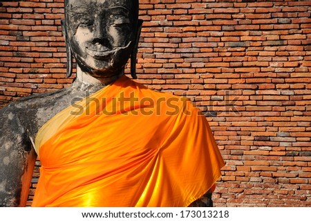art composition of ruins statue buddha with brick wall at Ayutthaya Historical Park, Thailand
