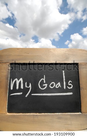 my goals on vintage slate blackboard with sky