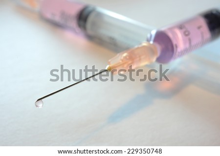 Medical and syringe on white background