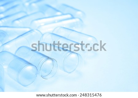 Empty capsules for background  with reflector.