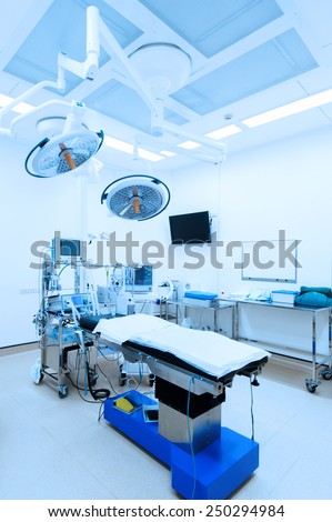 equipment and medical devices in modern operating room take with blue filter
