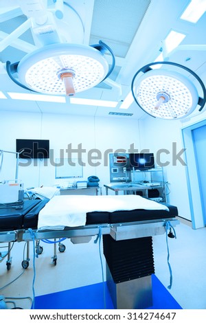 equipment and medical devices in modern operating room  take with art lighting and blue filter