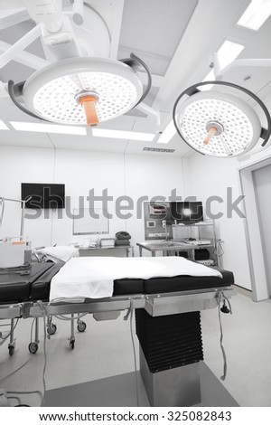 equipment and medical devices in modern operating room take with selective color technique and art lighting