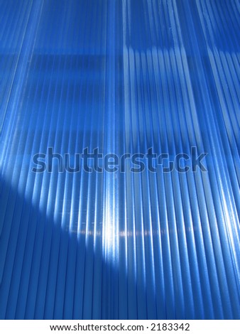 A contemporary building front covered in blue lexan.