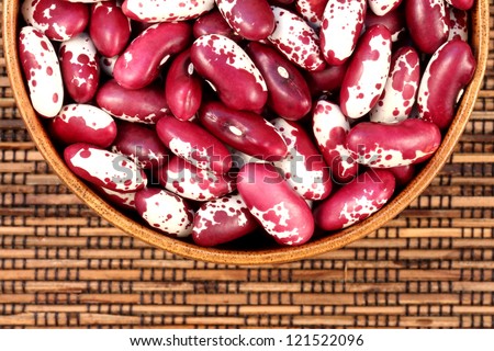 red and white beans, kidney beans in a wooden bowl on burlap can be used as background