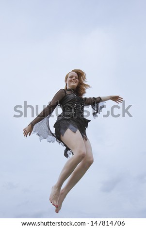Office girl jumping in the air