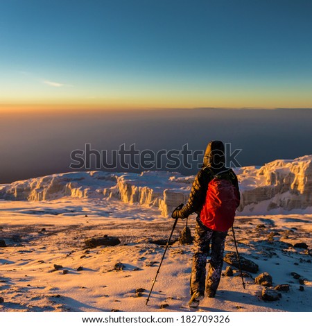 Human walking on the mountain Kilimanjaro glacier