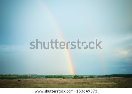 Landscape with double rainbow after the rain