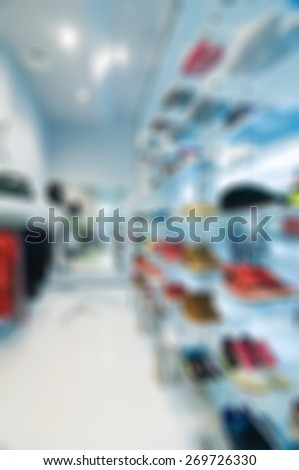 Abstract blur background. Interior of clothing store buitique in modern shopping mall