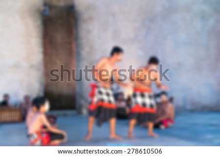Traditional Bali dance performance blur background with shallow depth of field bokeh effect