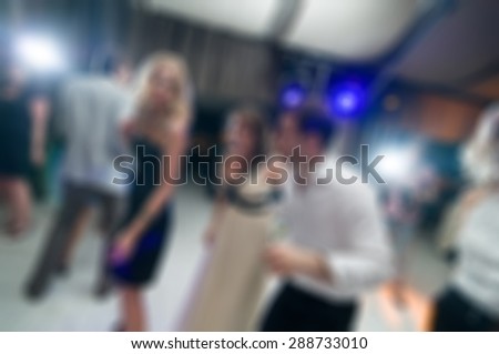 People dancing at the party abstract blur background with bokeh