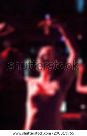 Night of flamenco dancing in a club blur background with shallow depth of field bokeh effect