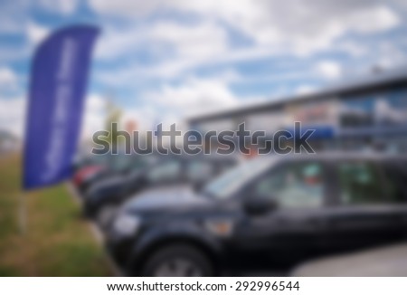 Car auto dealership themed blur background with bokeh effect