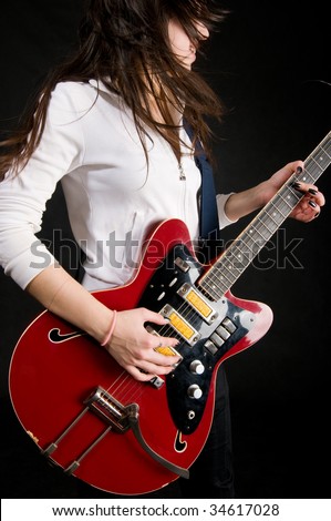 Girl playing electro guitar