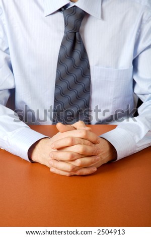 Businessman with clasped hands