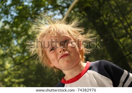 Boy on a Trampoline with Static in his Hair