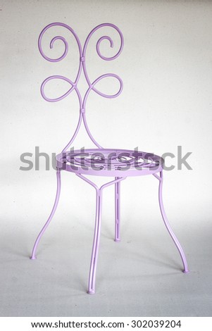 Purple chair iron furniture  on recycled Paper background