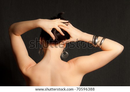 Woman\'s back with her hand on head