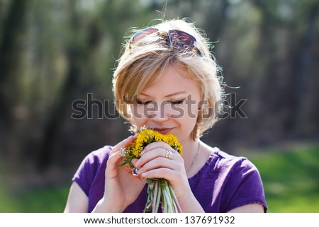 Woman smell dandelion, outdoor, nature