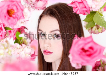 Woman with falling flowers, portrait
