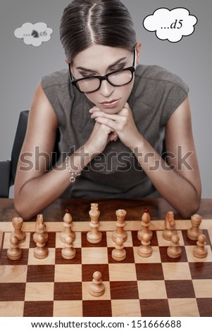 Beautiful chess player thinking, first move