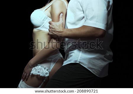 Strong man grab woman arm, passionate couple