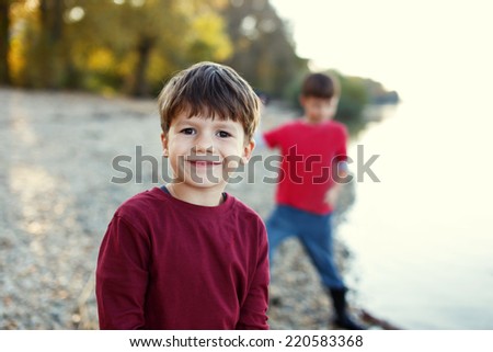Little brothers portrait at river, outdoor, childhood