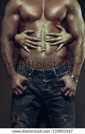 Hot couple at night, woman hands embracing sexy man abs, vintage style