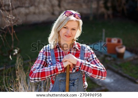 Fresh blonde woman outdoor works on sunny day