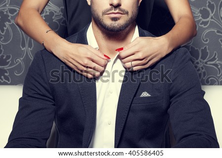 Woman hands undress sexy macho rich man