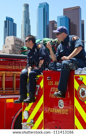 LOS ANGELES, CALIFORNIA, USA - MARCH 3, 2012: Unidentified firefighters watch the people at the Art Festival as a part of security in Los Angeles downtown on March 3, 2012 in Los Angeles, California