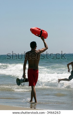 Lifeguard on California beach ready for rescue
