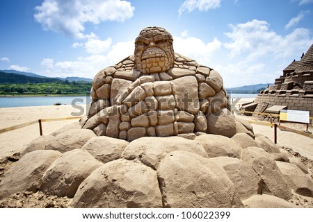 FULONG, TAIWAN-MAY 23,2012:a stoneman sand sculpture at Fulong beach for celebrating the Sand Sculpture Festival on May 23,2012 in Fulong,Taiwan