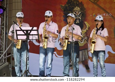 NEW TAIPEI CITY,TAIWAN -November 3,2012:saxophone performance in LuZhou elementary School for celebrating the Taiwanese Traditional Art Festival on November 3,2012 in New Taipei City,Taiwan .
