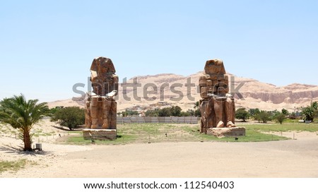 The Colossi of Memnon (1350 BC), giant statues of Pharaoh Amenhotep near the Valley of the Kings, in Luxor, Egypt.