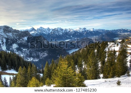 Mountains and lakes in winter (Allgäu Alps in Bavaria, Germany). The alpine regions of the Allgaeu (Allgäu) rise over 2,000 meters in altitude and are popular for winter skiing.