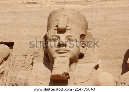 Close-up of one of the colossal statues of Ramesses II, wearing the double crown of Lower and Upper Egypt.