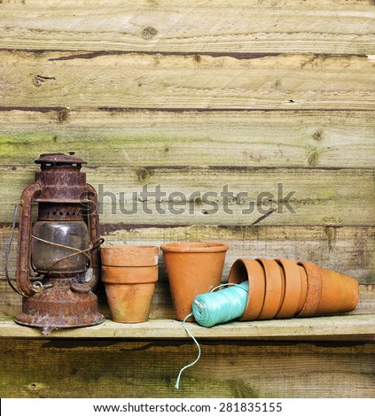 Flowerpots in garden shed; gardening paraphernalia in potting shed; excellent copy space