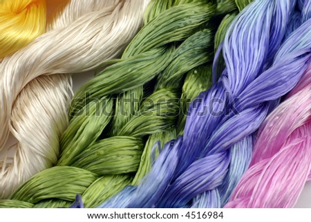 sewing silk; differential focus; pink, blue, yellow, green and cream