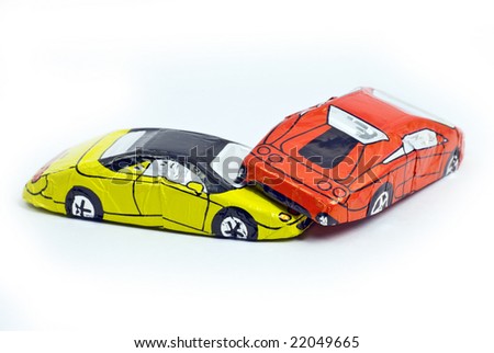 crash between two chocolate cars; isolated on white ground