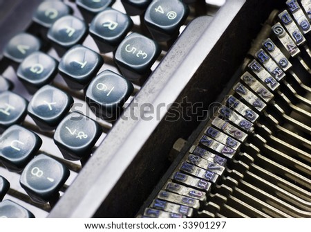 vintage manual typewriter showing keyboard and print-head area
