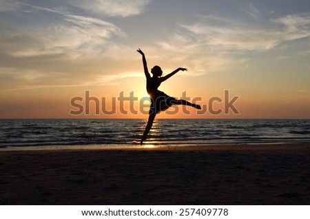 Ballet dancer\'s silhouette by the Sea in Sunset light