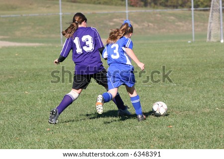 Girls Fighting for Soccer Ball
