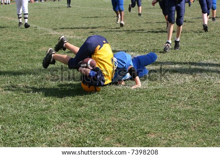 Football Tackle While Standing on Head