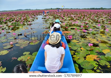 People on Boat in Lotus Flowers Lake