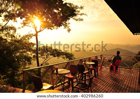 A Man Relax at The Cafe on The Hill