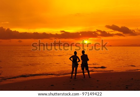 Love Couple Silhouette on Beach at Sunset Background